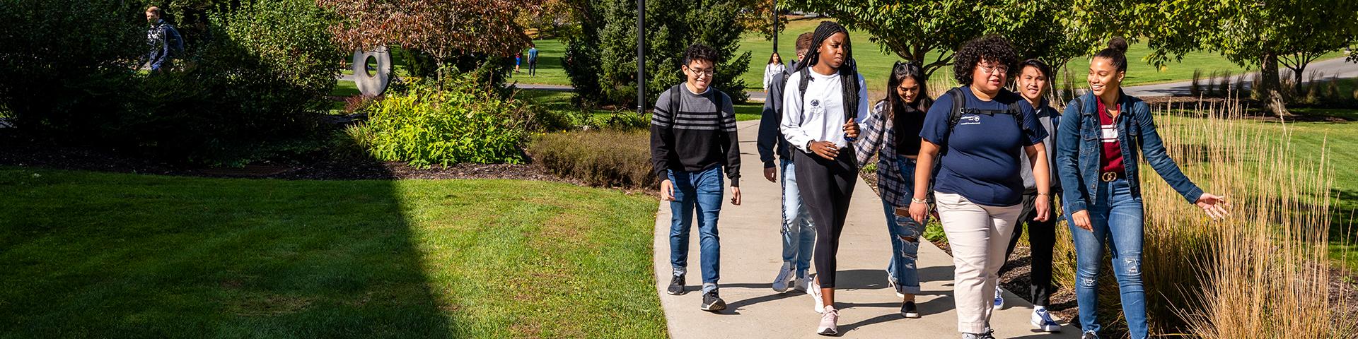 Group of students walking towards Perkins Plaza